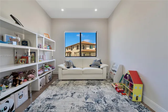 a room with furniture and a book shelf