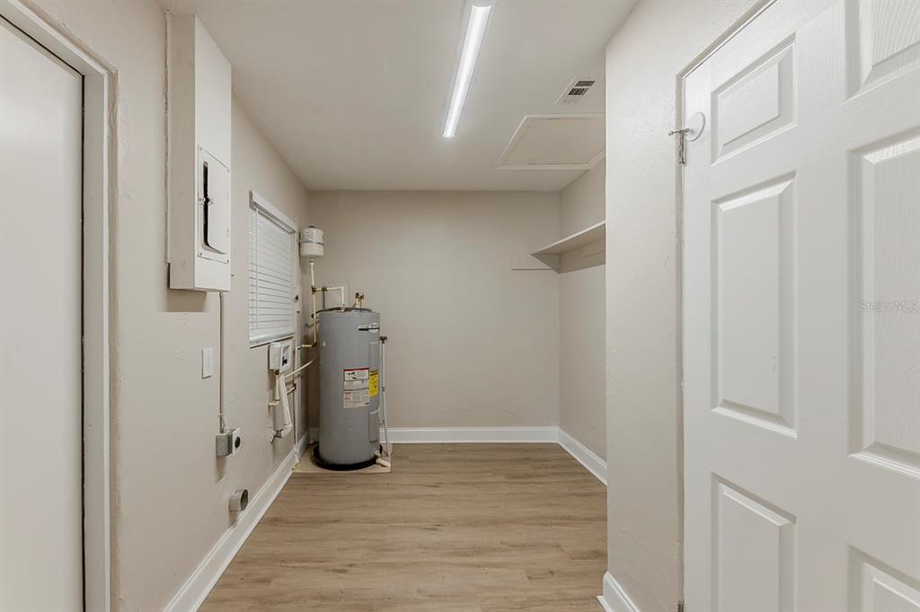 5500 Riviera Drive Orlando, FL 32808 - Photo 19 of 48 a view of a storage & utility room with a sink