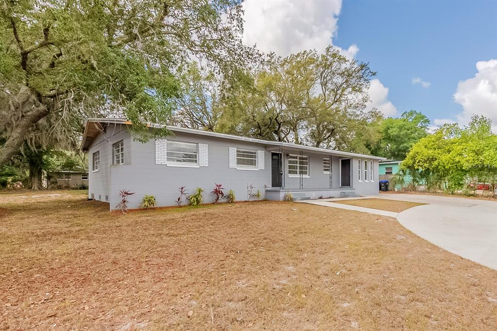 5500 Riviera Drive Orlando, FL 32808 - Photo 3 of 48 a front view of house with yard and trees