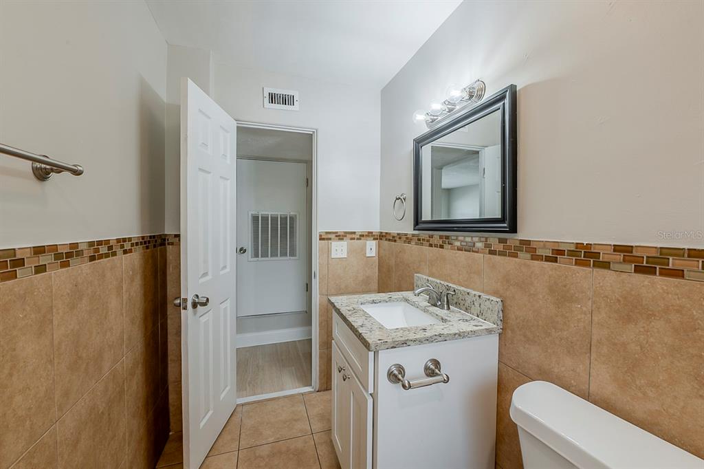 5500 Riviera Drive Orlando, FL 32808 - Photo 33 of 48 a bathroom with a sink a toilet and shower