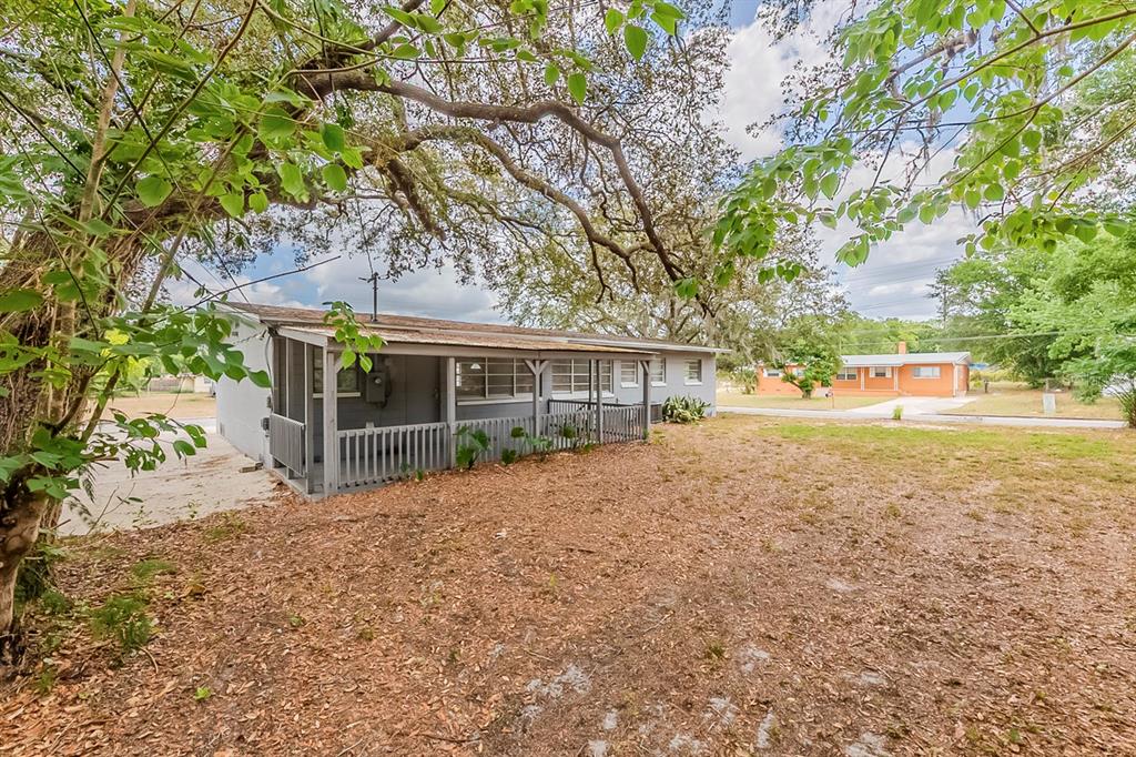 5500 Riviera Drive Orlando, FL 32808 - Photo 45 of 48 a view of backyard of house with green space