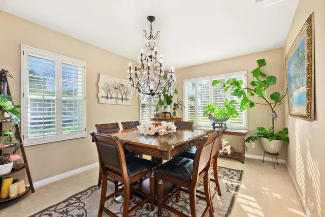 a view of a dining room with furniture and window