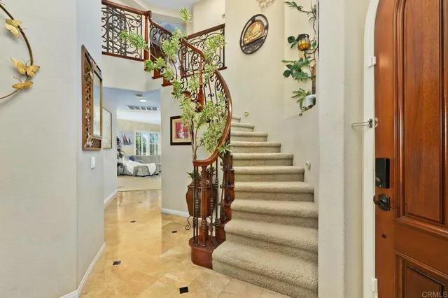 a spacious bedroom with a bed and a large window