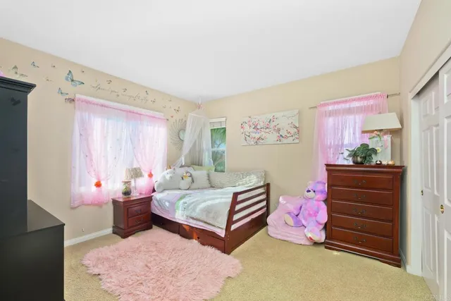 a bathroom with a tub sink a mirror and a potted plant