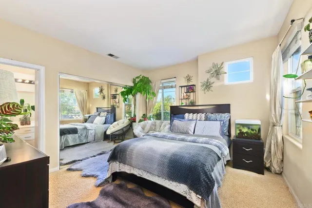 a bathroom with a sink vanity mirror and toilet