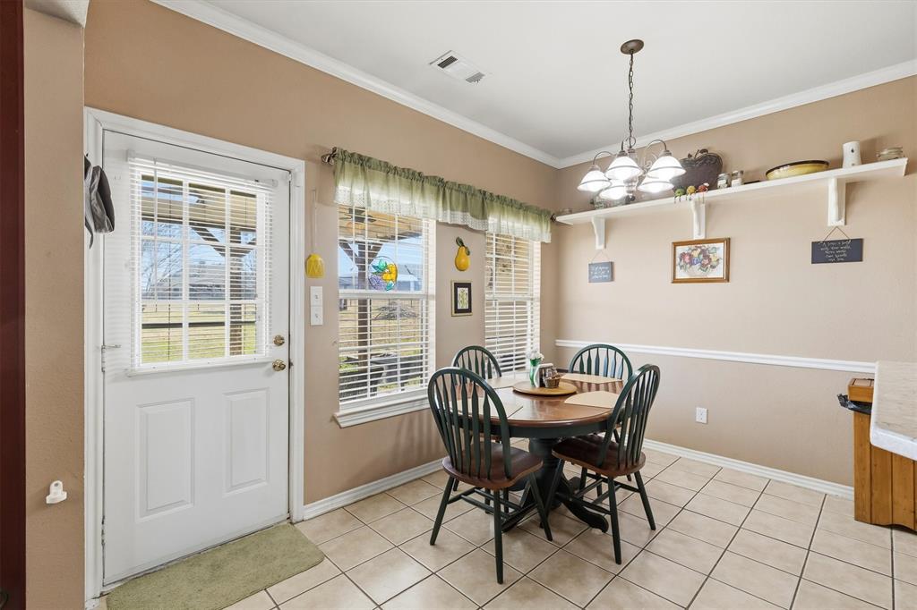 9920 County Road 540 Lavon, TX 75166 - Photo 12 of 32 a dining room with furniture and window
