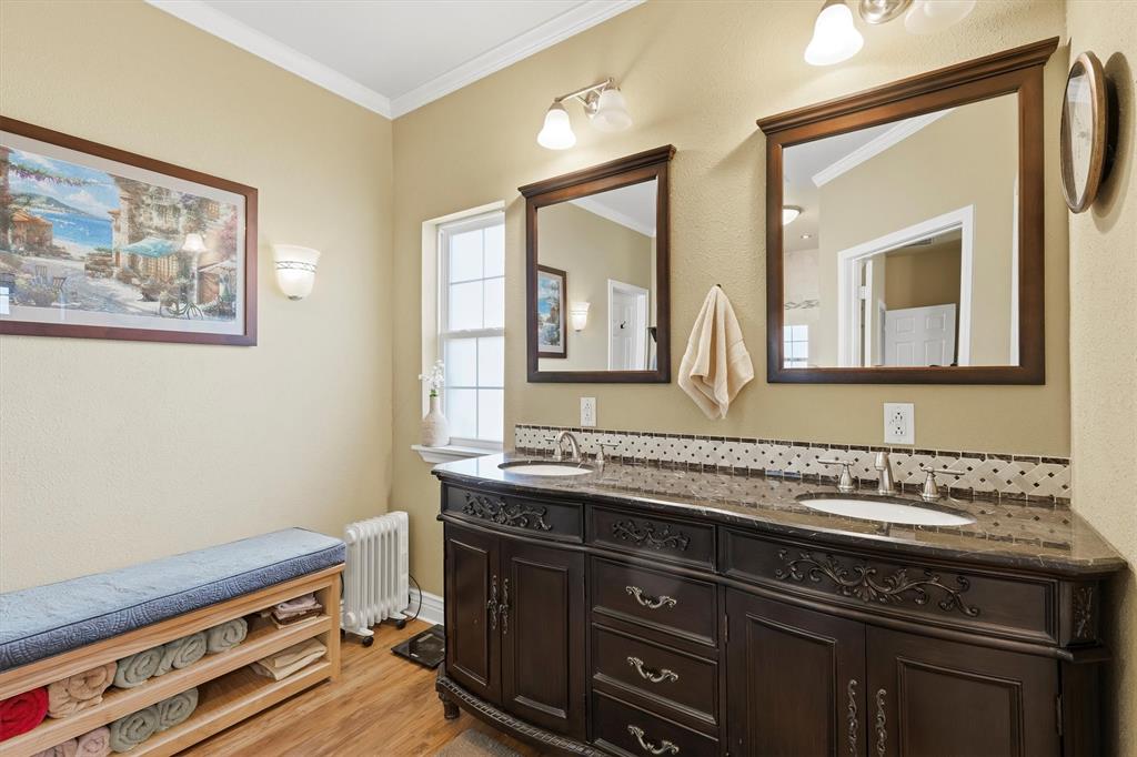 9920 County Road 540 Lavon, TX 75166 - Photo 16 of 32 a bathroom with a sink and a mirror