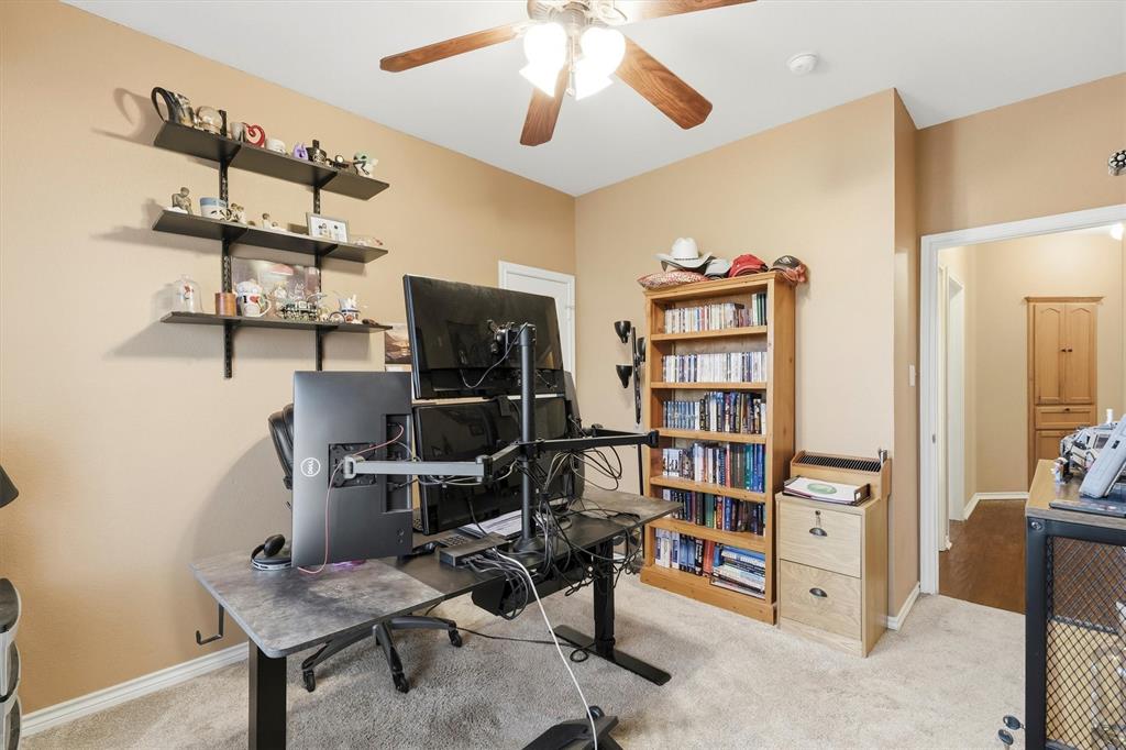 9920 County Road 540 Lavon, TX 75166 - Photo 20 of 32 a view of a workspace with furniture and a window