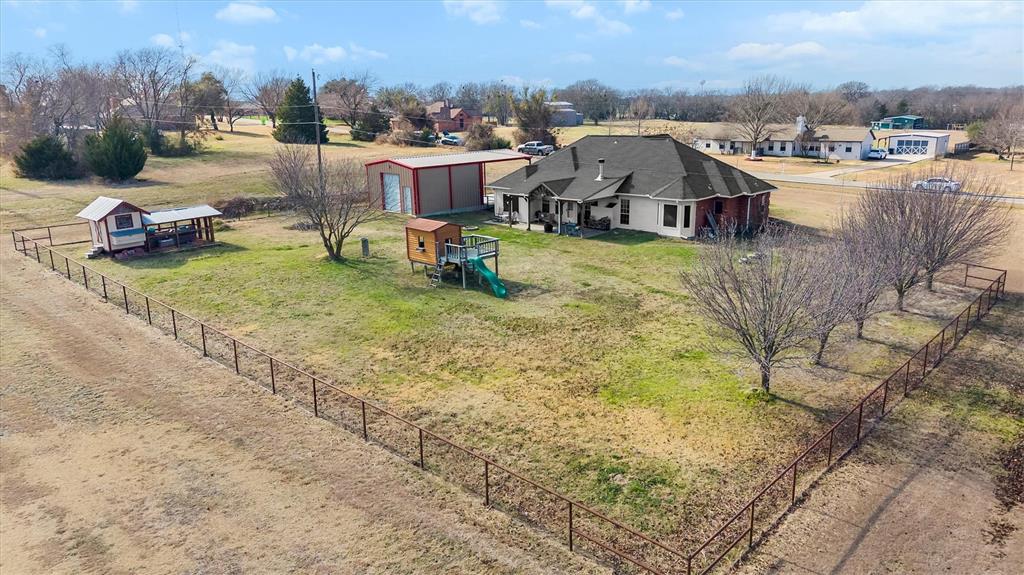 9920 County Road 540 Lavon, TX 75166 - Photo 2 of 32 a view of a house with a yard and sitting area