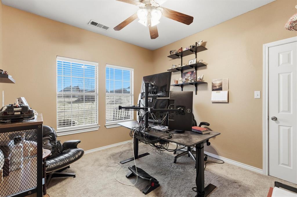 9920 County Road 540 Lavon, TX 75166 - Photo 21 of 32 a view of a livingroom with workspace and a window