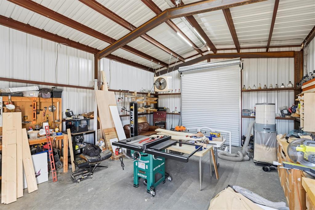 9920 County Road 540 Lavon, TX 75166 - Photo 24 of 32 a view of a storage with a table and chairs