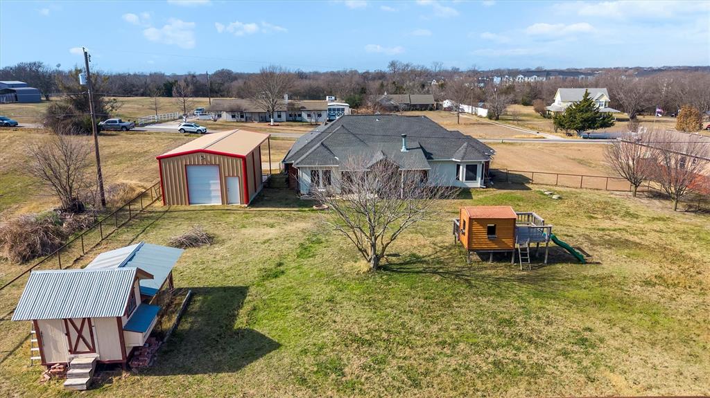 9920 County Road 540 Lavon, TX 75166 - Photo 27 of 32 an aerial view of a house with a garden and lake view