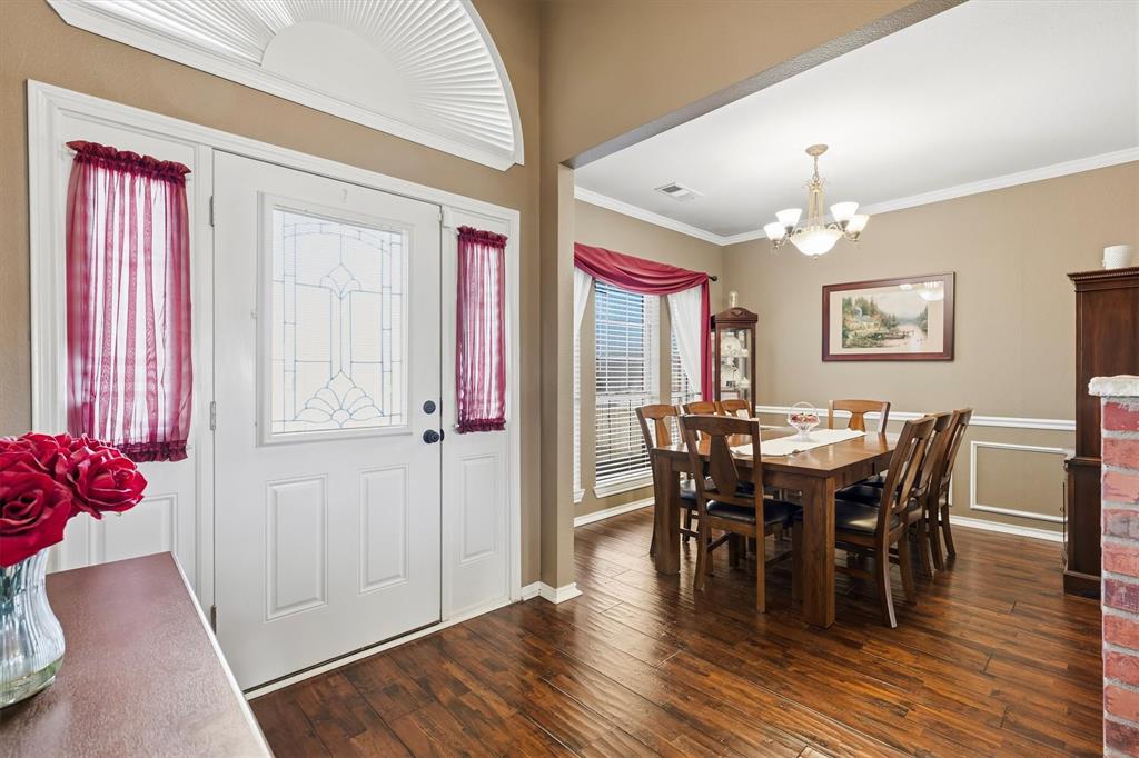9920 County Road 540 Lavon, TX 75166 - Photo 7 of 32 a view of a dining room with furniture and wooden floor