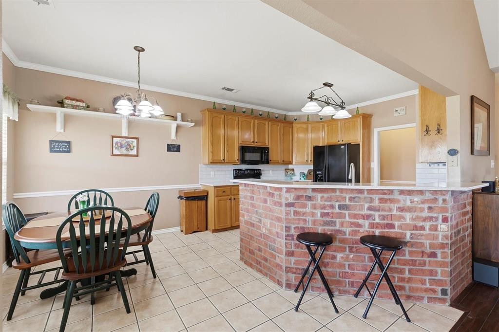 9920 County Road 540 Lavon, TX 75166 - Photo 9 of 32 a dining room with furniture and window