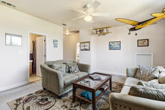 a view of outdoor space with playground and green space
