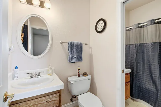 a view of swimming pool with a yard and large trees