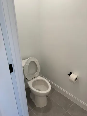 a bathroom with a toilet and a sink