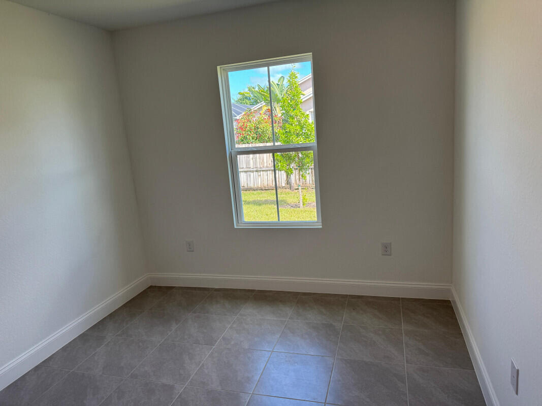 1073 Southwest Benchor Avenue Port St. Lucie, FL 34953 - Photo 15 of 23 an empty room with a window