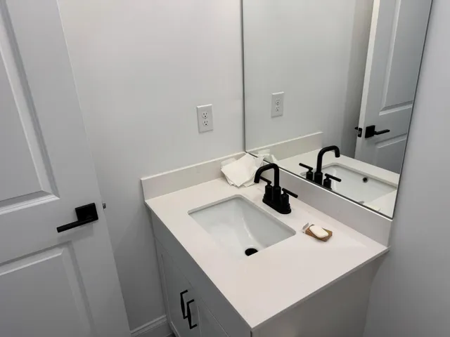a bathroom with a sink and a mirror