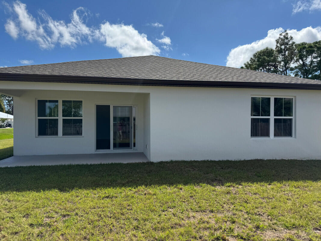 1073 Southwest Benchor Avenue Port St. Lucie, FL 34953 - Photo 20 of 23 a view of swimming pool with an outdoor space