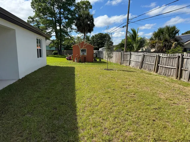 a view of a backyard with a garden and plants