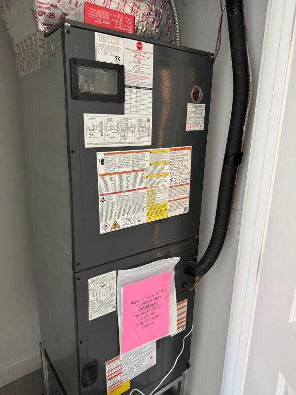 1073 Southwest Benchor Avenue Port St. Lucie, FL 34953 - Photo 23 of 23 view of living room with washer and dryer