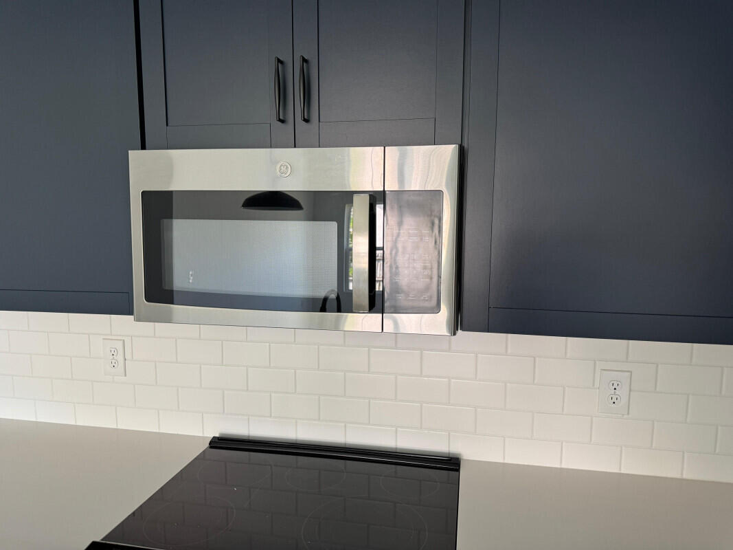 1073 Southwest Benchor Avenue Port St. Lucie, FL 34953 - Photo 3 of 23 a bathroom with a sink and a mirror