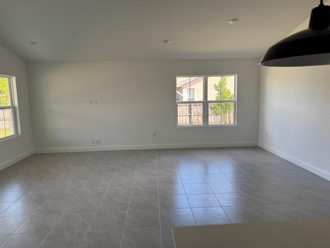 1073 Southwest Benchor Avenue Port St. Lucie, FL 34953 - Photo 8 of 23 an empty room with a window