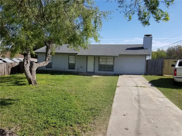 a house view with a garden space