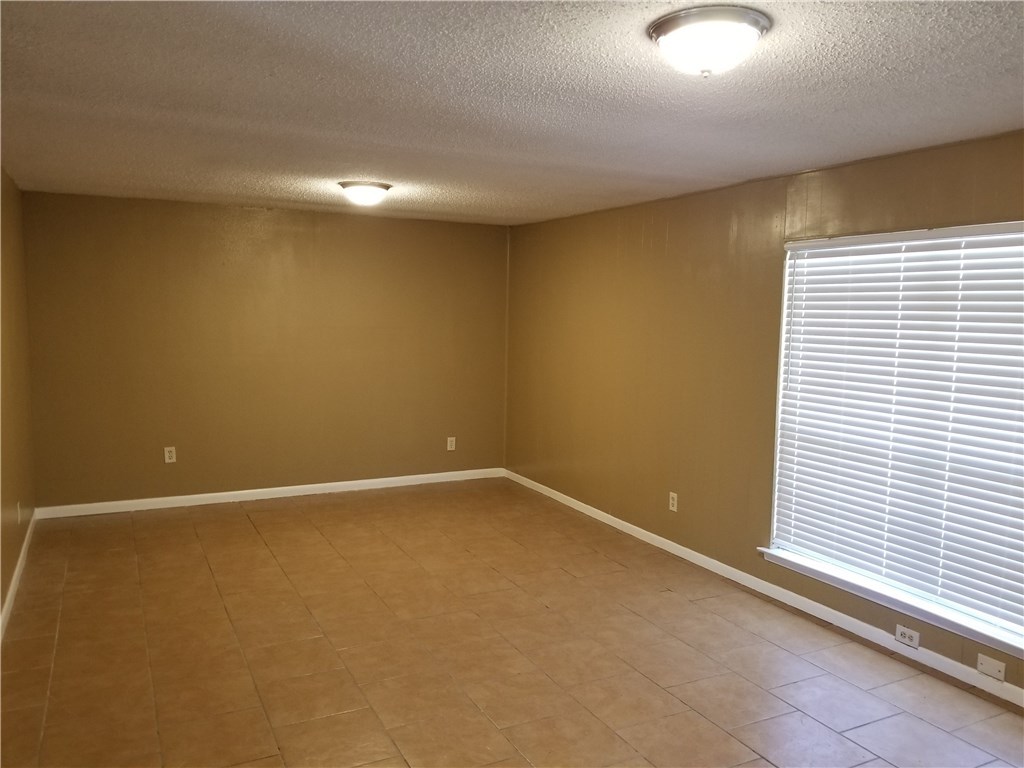 4628 Callicoatte Road Corpus Christi, TX 78410 - Photo 2 of 6 a view of an empty room with a window
