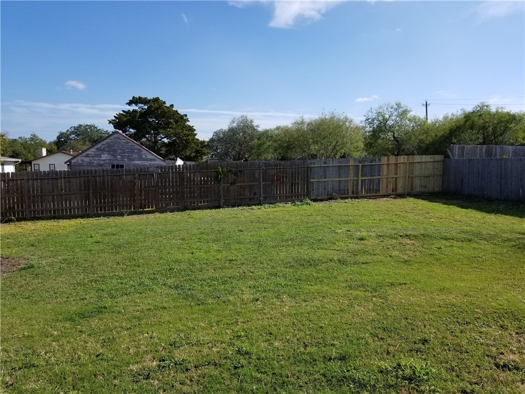 4628 Callicoatte Road Corpus Christi, TX 78410 - Photo 5 of 6 a swimming pool that is in front of a house