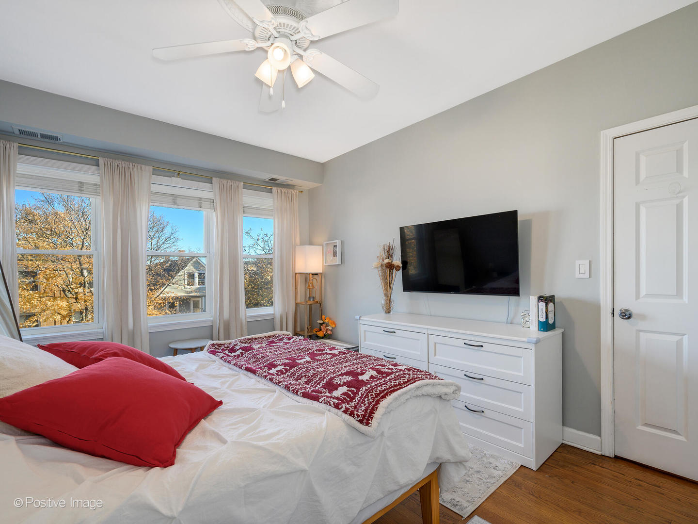 4022 North Monticello Avenue, Unit 3N Chicago, IL 60618 - Photo 11 of 21 a bedroom with a bed and a flat screen tv