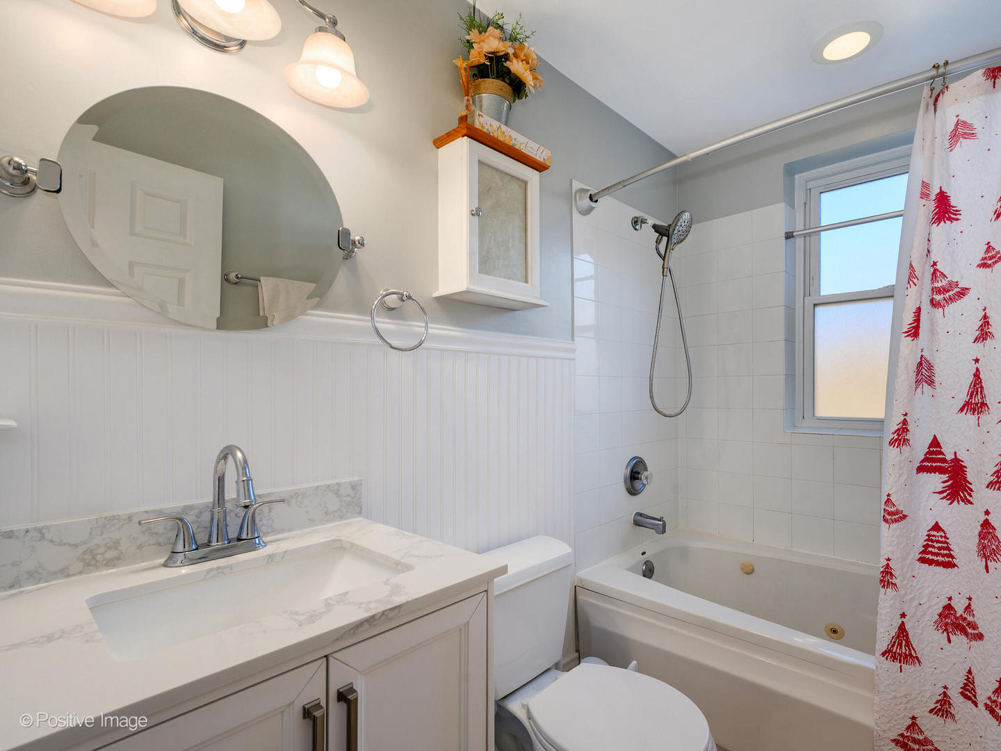 4022 North Monticello Avenue, Unit 3N Chicago, IL 60618 - Photo 15 of 21 a bathroom with a sink vanity mirror and bathtub