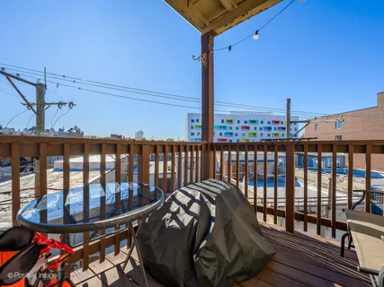 a view of a balcony with chairs