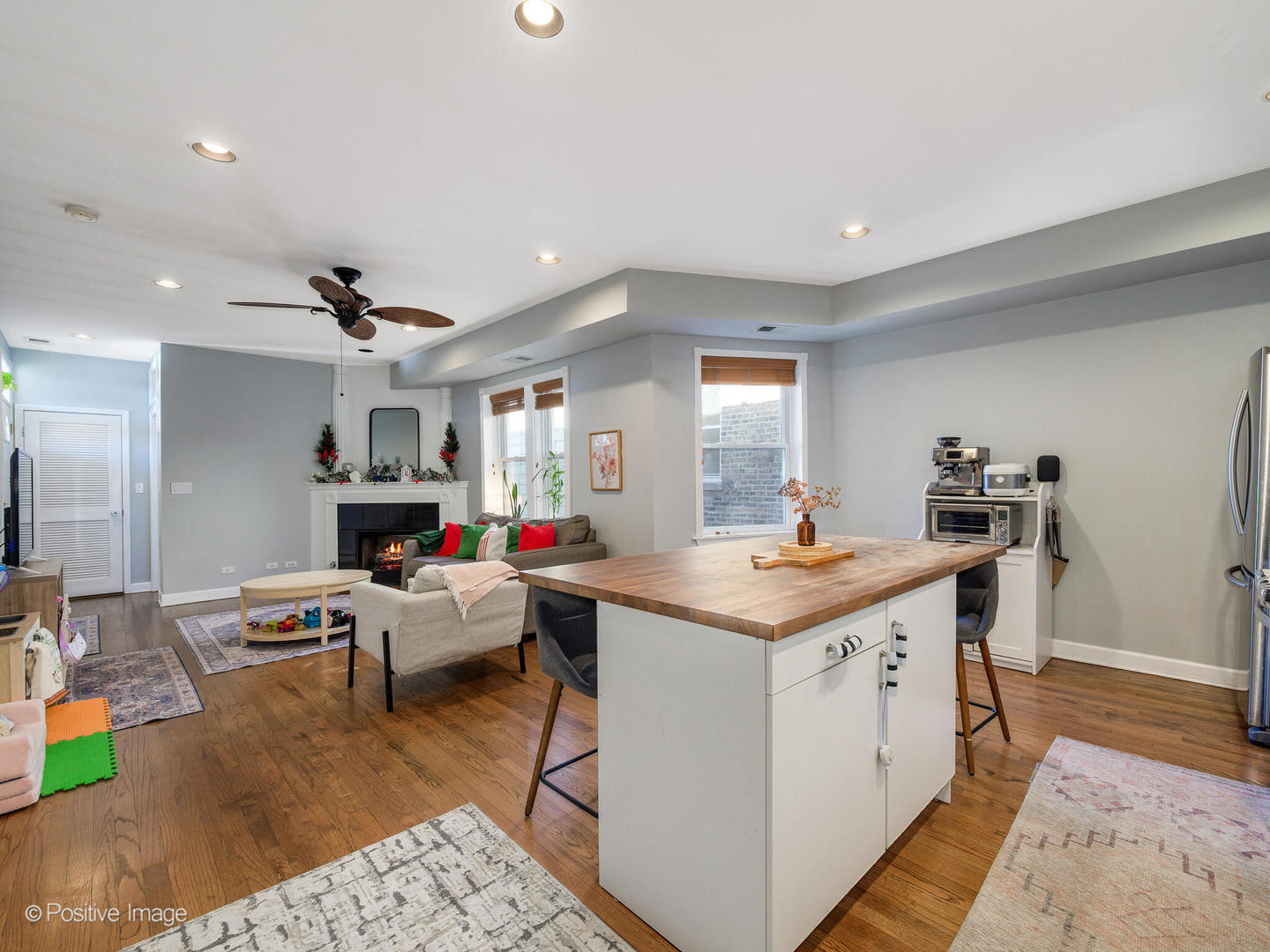 4022 North Monticello Avenue, Unit 3N Chicago, IL 60618 - Photo 3 of 21 a living room with stainless steel appliances furniture a rug and a kitchen view