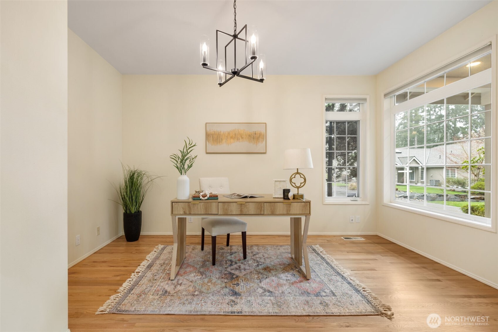 7033 Prestwick Lane Southwest Port Orchard, WA 98367 - Photo 13 of 39 a dining room with wooden floor and a rug