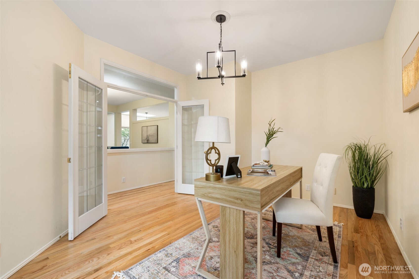 7033 Prestwick Lane Southwest Port Orchard, WA 98367 - Photo 14 of 39 a view of a dining room with furniture and wooden floor