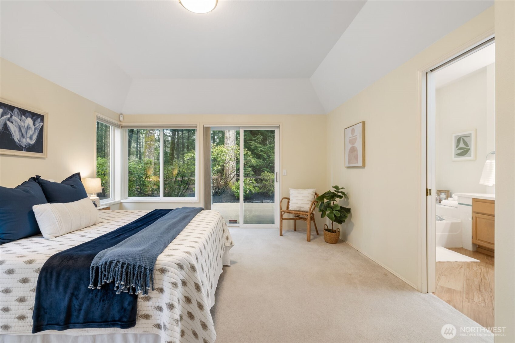 7033 Prestwick Lane Southwest Port Orchard, WA 98367 - Photo 18 of 39 a spacious bedroom with a bed and a large window