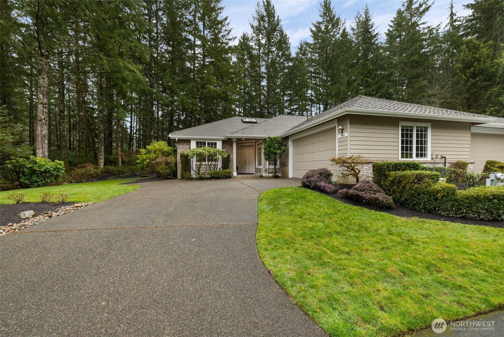 7033 Prestwick Lane Southwest Port Orchard, WA 98367 - Photo 2 of 39 a view of a house with a backyard