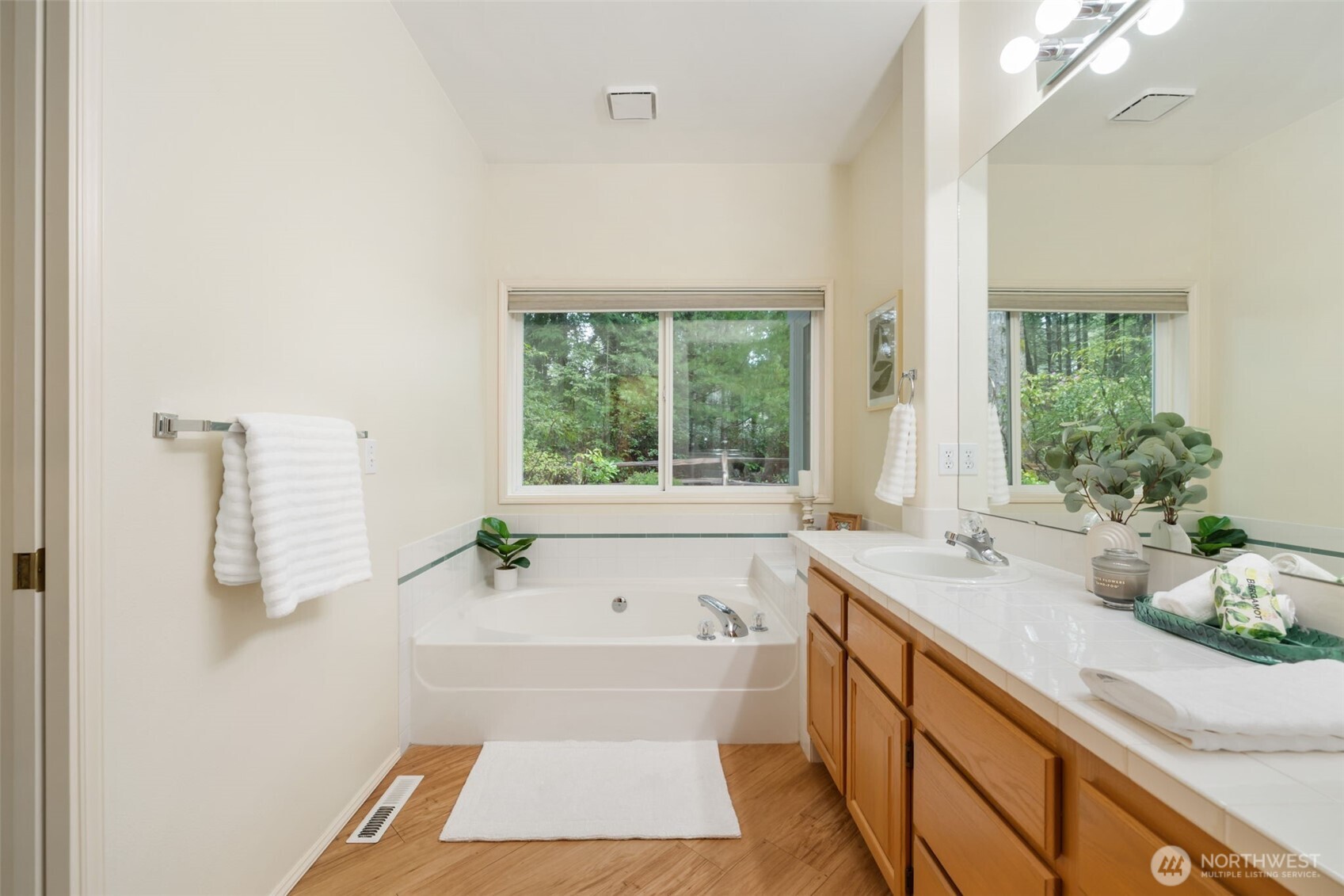 7033 Prestwick Lane Southwest Port Orchard, WA 98367 - Photo 21 of 39 a bathroom with a tub sink and window