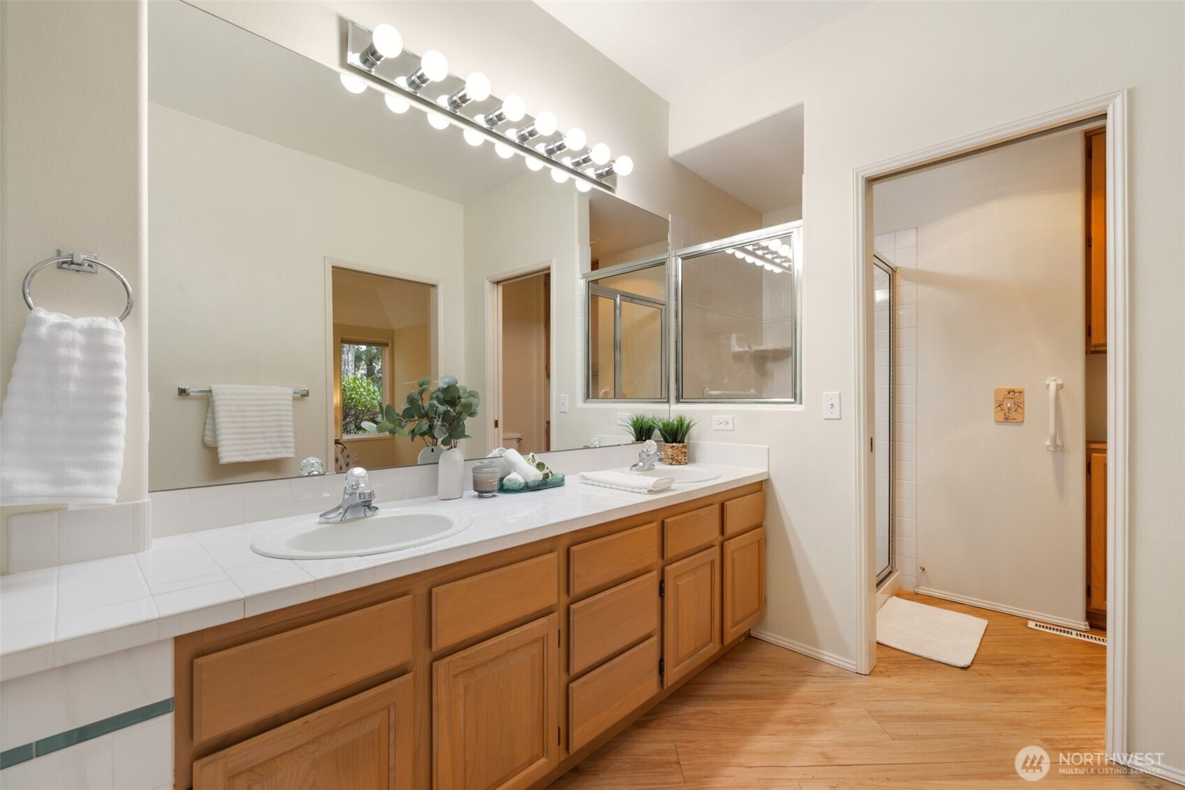 7033 Prestwick Lane Southwest Port Orchard, WA 98367 - Photo 22 of 39 a bathroom with a double vanity sink mirror and shower