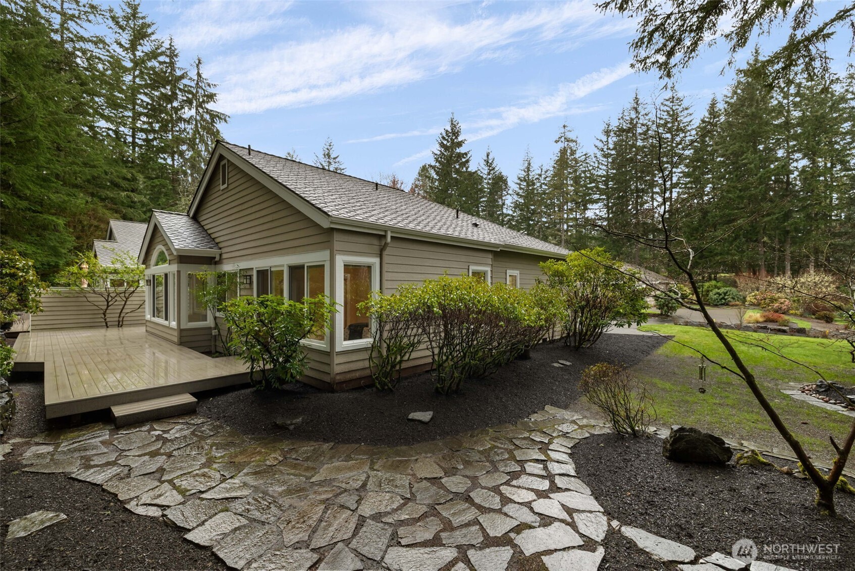 7033 Prestwick Lane Southwest Port Orchard, WA 98367 - Photo 27 of 39 a view of a house with backyard and sitting area