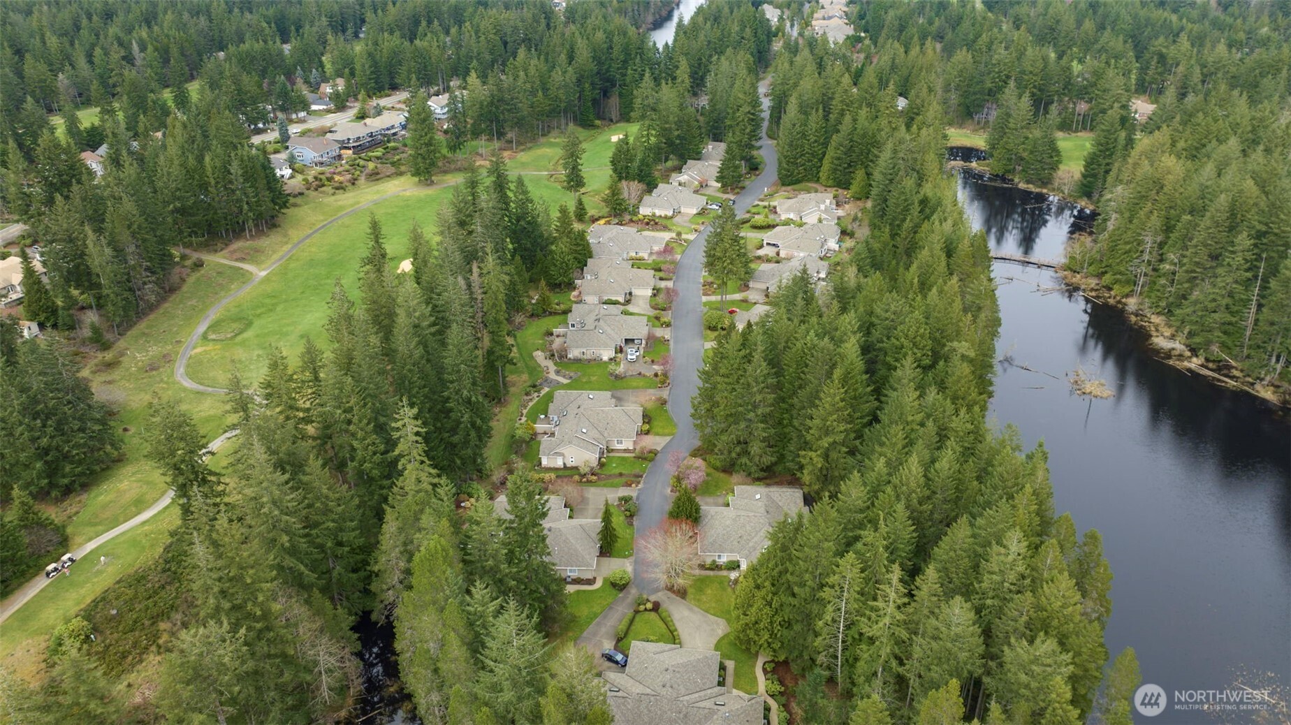 7033 Prestwick Lane Southwest Port Orchard, WA 98367 - Photo 30 of 39 a aerial view of residential houses with outdoor space and trees
