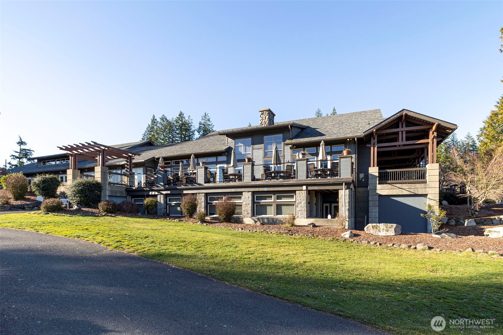 7033 Prestwick Lane Southwest Port Orchard, WA 98367 - Photo 33 of 39 a view of a house with swimming pool and yard