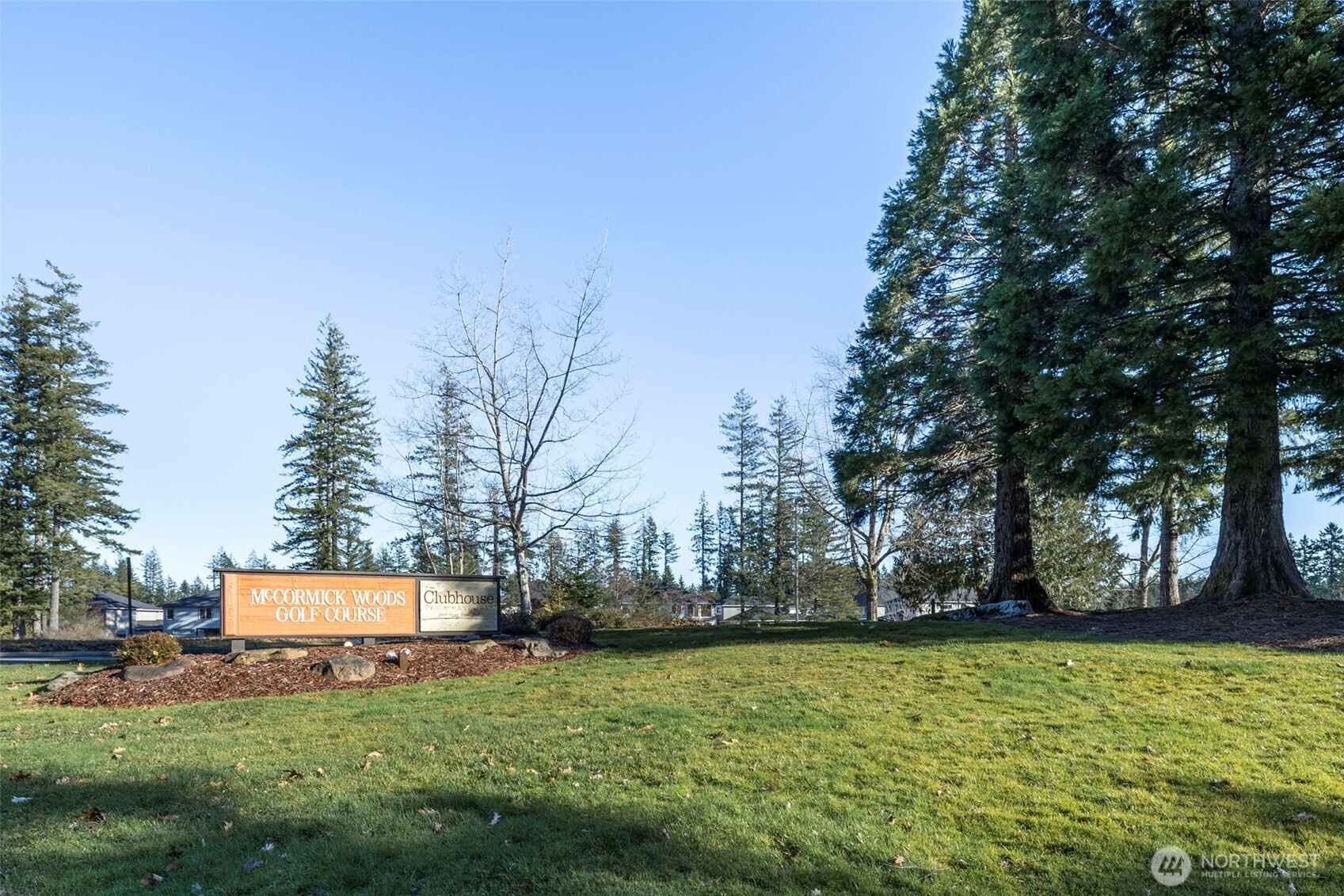 7033 Prestwick Lane Southwest Port Orchard, WA 98367 - Photo 37 of 39 a backyard of a house with lots of green space