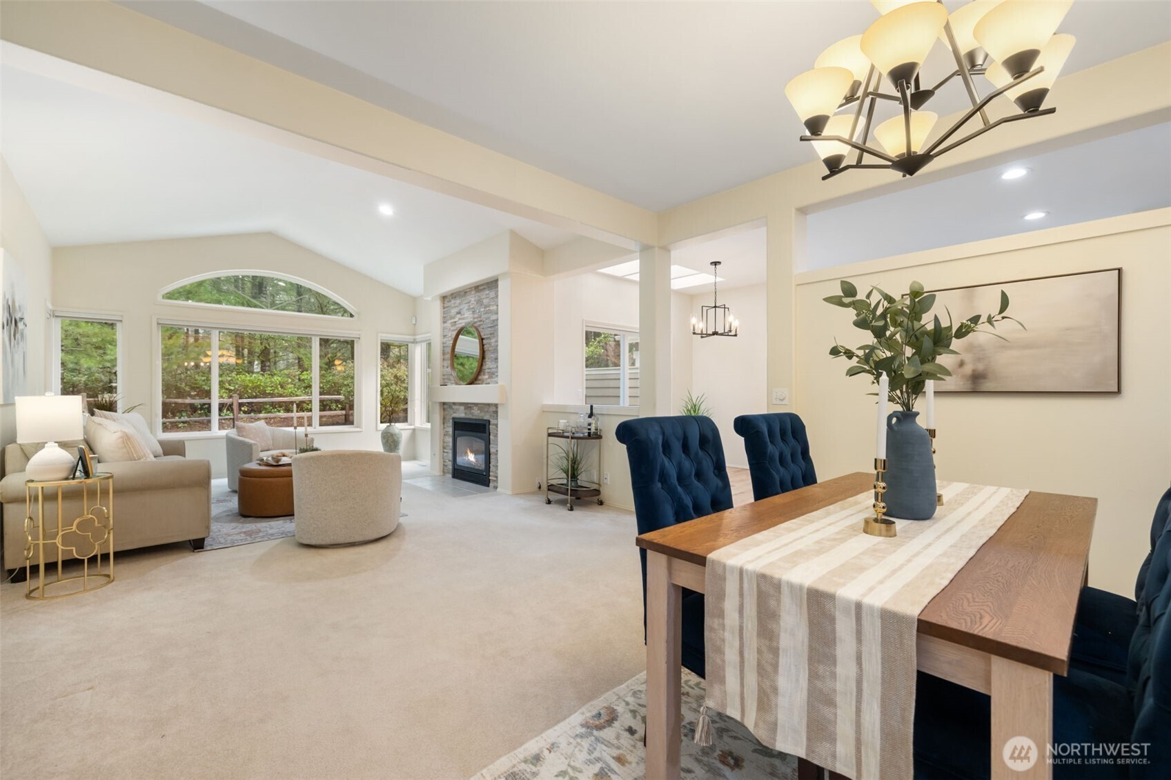 7033 Prestwick Lane Southwest Port Orchard, WA 98367 - Photo 5 of 39 a living room with furniture and a chandelier