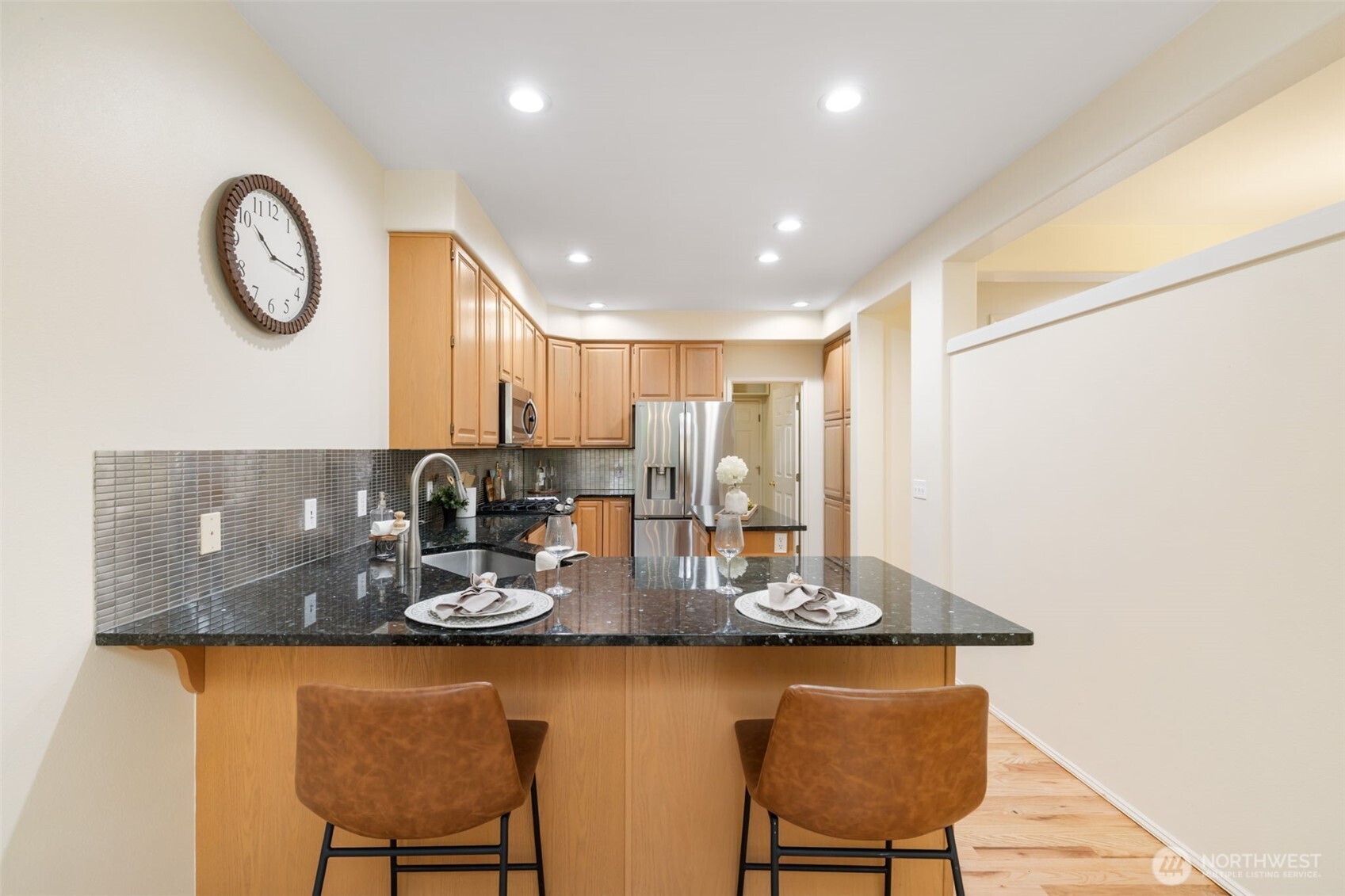 7033 Prestwick Lane Southwest Port Orchard, WA 98367 - Photo 9 of 39 a kitchen with a table and chairs