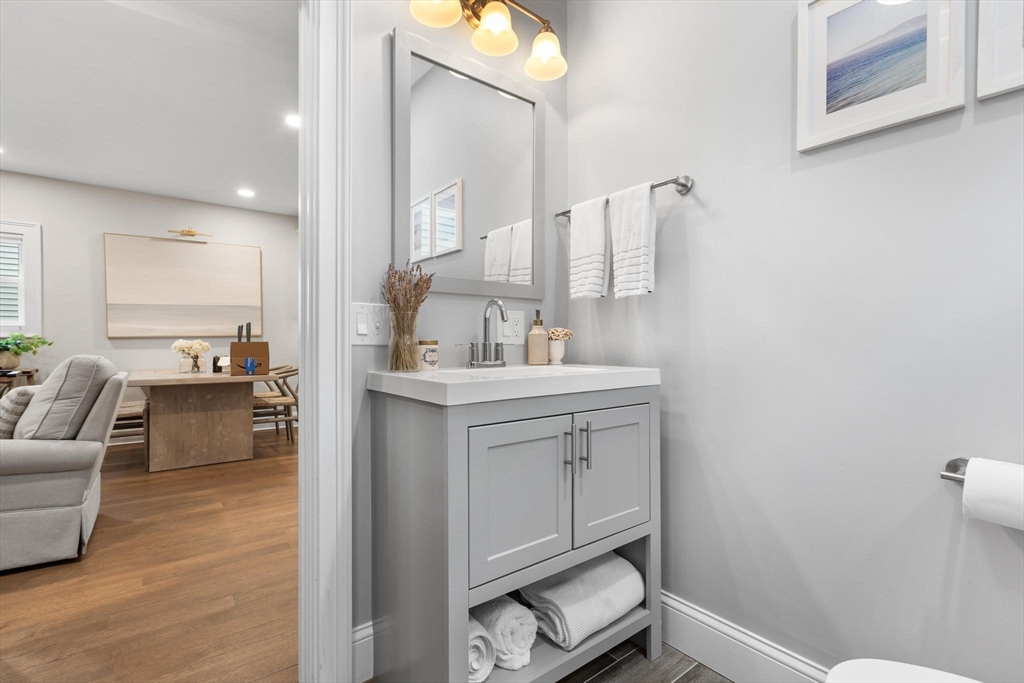 43 Alfred Street, Unit A Everett, MA 02149 - Photo 16 of 29 a bathroom with a sink a toilet and mirror