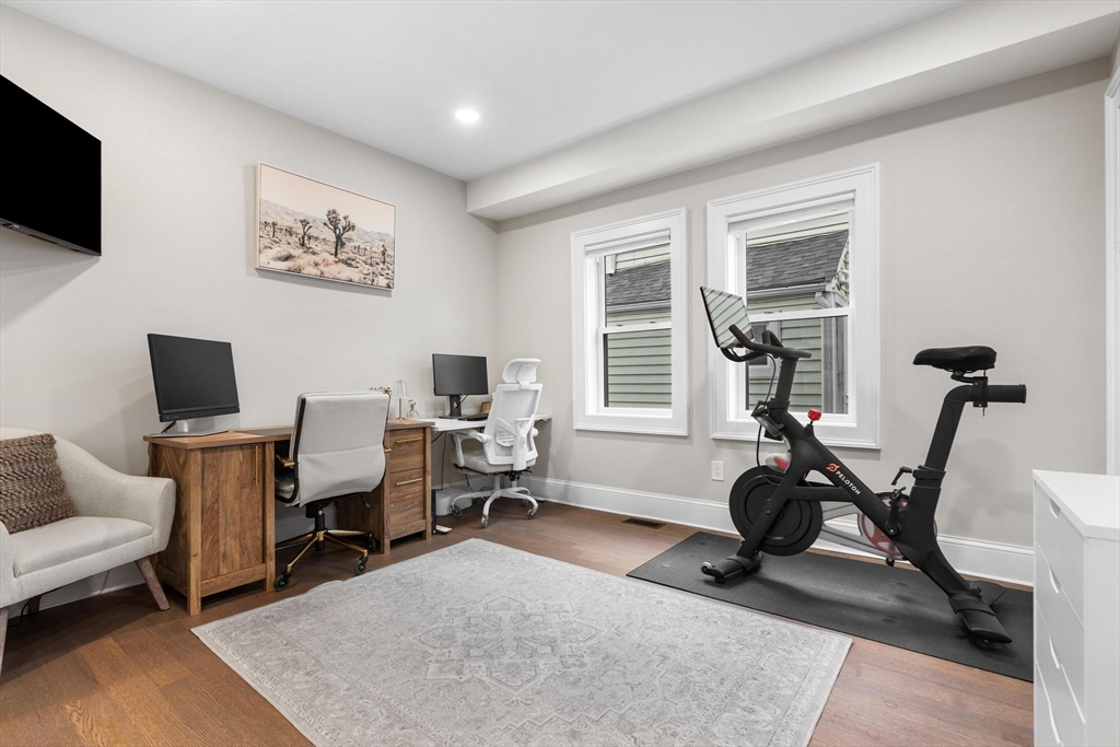 43 Alfred Street, Unit A Everett, MA 02149 - Photo 18 of 29 a living room with furniture a flat screen tv and a window