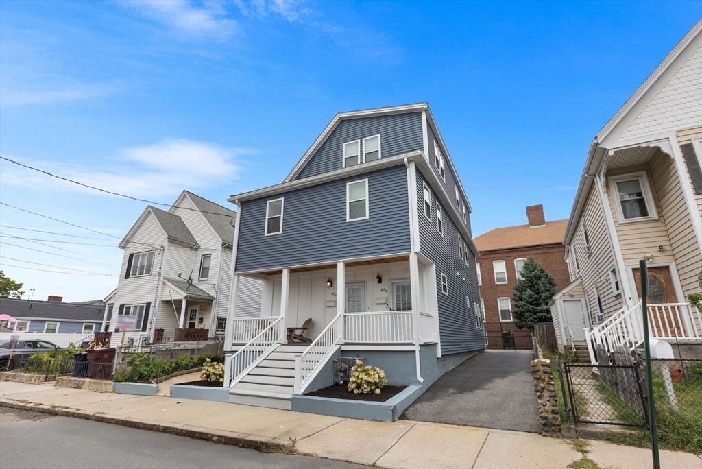 43 Alfred Street, Unit A Everett, MA 02149 - Photo 2 of 29 a front view of a house with a yard